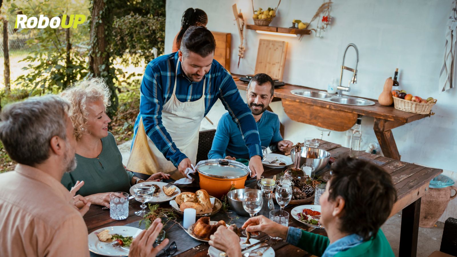 man-standing-over-dining-table-friends.jpg