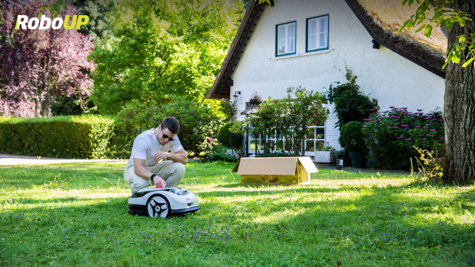 man-petting-robot-mower.jpg