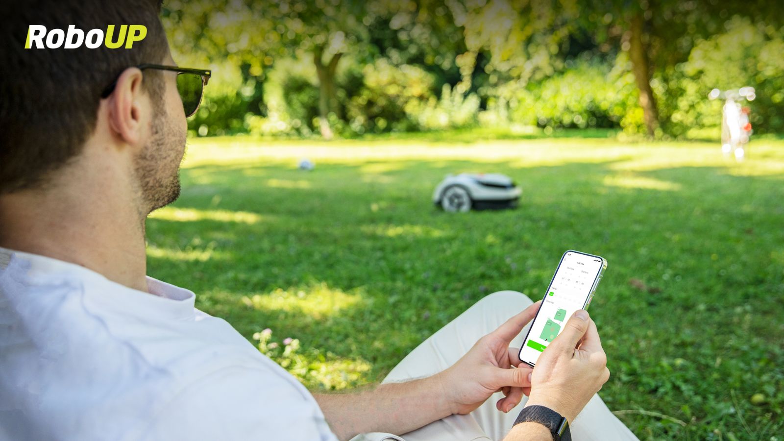 man-control-robot-mower-via-app.jpg
