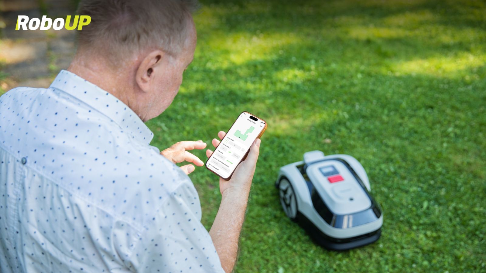 old-man-operate-robot-mower-app.jpg